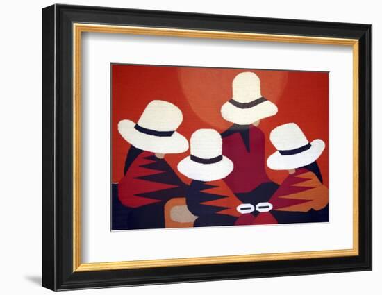 Colorful blanket picturing indigenous women at the market in Otavalo, Ecuador.-Miva Stock-Framed Photographic Print