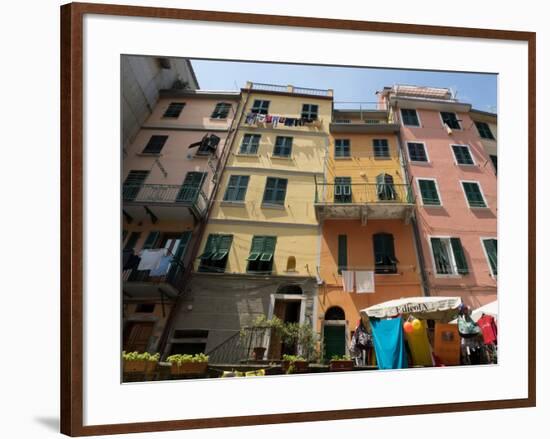 Colorful buildings with clothes hanging out to dry, Riomaggiore, La Spezia, Liguria, Italy-null-Framed Photographic Print