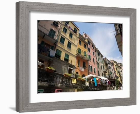 Colorful buildings with clothes hanging out to dry, Riomaggiore, La Spezia, Liguria, Italy-null-Framed Photographic Print