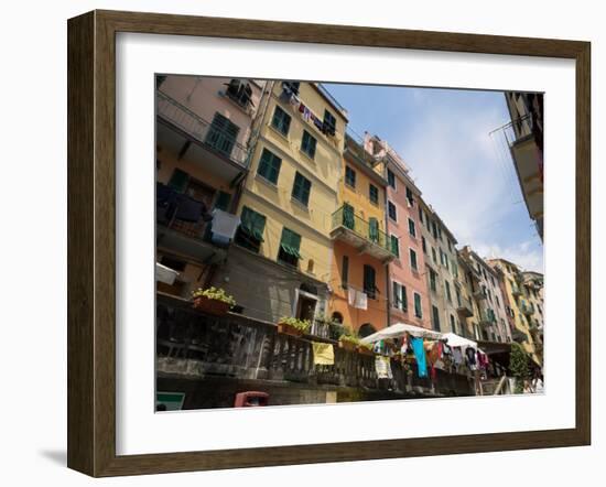 Colorful buildings with clothes hanging out to dry, Riomaggiore, La Spezia, Liguria, Italy-null-Framed Photographic Print
