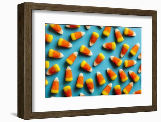 Colorful Candy Corn for Halloween on a Background-Brent Hofacker-Framed Photographic Print