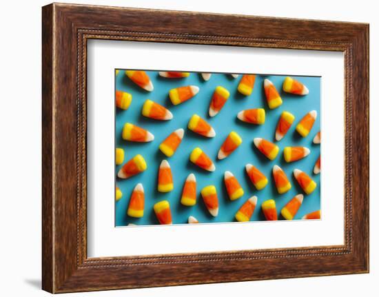 Colorful Candy Corn for Halloween on a Background-Brent Hofacker-Framed Photographic Print