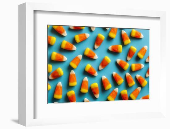 Colorful Candy Corn for Halloween on a Background-Brent Hofacker-Framed Photographic Print
