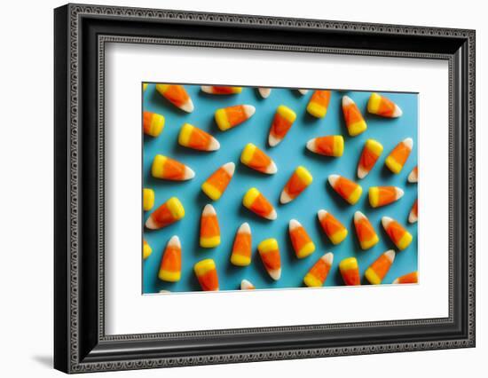 Colorful Candy Corn for Halloween on a Background-Brent Hofacker-Framed Photographic Print