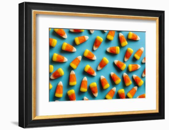 Colorful Candy Corn for Halloween on a Background-Brent Hofacker-Framed Photographic Print