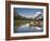 Colorful Canoes Line the Dock at Many Glacier Lodge on Swiftcurrent Lake During Sunrise-Brad Beck-Framed Photographic Print