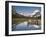 Colorful Canoes Line the Dock at Many Glacier Lodge on Swiftcurrent Lake During Sunrise-Brad Beck-Framed Photographic Print