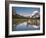 Colorful Canoes Line the Dock at Many Glacier Lodge on Swiftcurrent Lake During Sunrise-Brad Beck-Framed Photographic Print