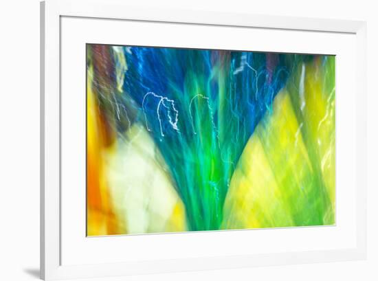 Colorful glass with blurred motion effect.-Stuart Westmorland-Framed Premium Photographic Print