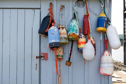 Colorful Lobster Buoys Hanging on an Old Shed' Photographic Print - flyzone