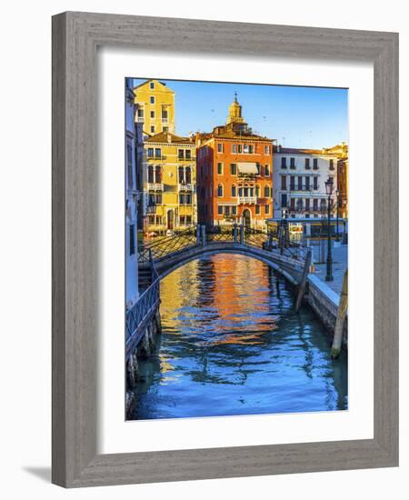 Colorful small canal and bridge Grand Canal creating beautiful reflection in Venice, Italy.-William Perry-Framed Photographic Print