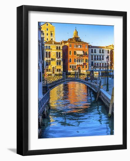 Colorful small canal and bridge Grand Canal creating beautiful reflection in Venice, Italy.-William Perry-Framed Photographic Print