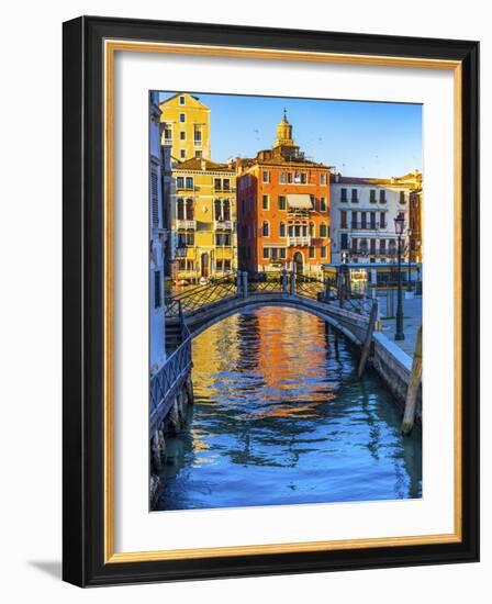 Colorful small canal and bridge Grand Canal creating beautiful reflection in Venice, Italy.-William Perry-Framed Photographic Print