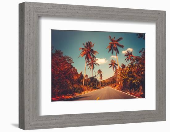 Colorful Sunset Landscape with Empty Road and Palm Trees in Jungle against Clear Blue Sky. Vintage-goinyk-Framed Photographic Print