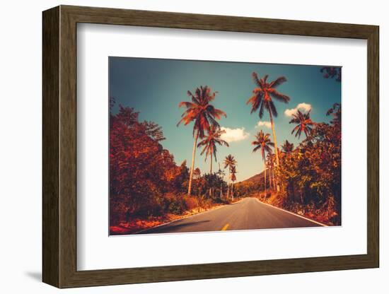 Colorful Sunset Landscape with Empty Road and Palm Trees in Jungle against Clear Blue Sky. Vintage-goinyk-Framed Photographic Print