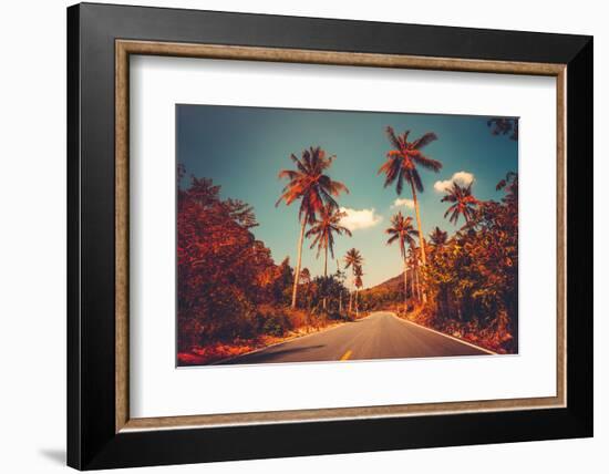 Colorful Sunset Landscape with Empty Road and Palm Trees in Jungle against Clear Blue Sky. Vintage-goinyk-Framed Photographic Print