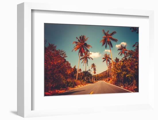 Colorful Sunset Landscape with Empty Road and Palm Trees in Jungle against Clear Blue Sky. Vintage-goinyk-Framed Photographic Print