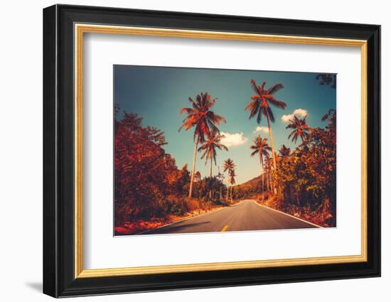 Colorful Sunset Landscape with Empty Road and Palm Trees in Jungle against Clear Blue Sky. Vintage-goinyk-Framed Photographic Print