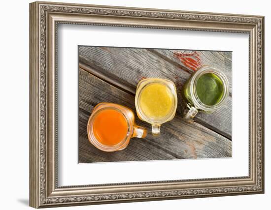 Colorful Trio of Fresh Fruit Juice in Glass Jugs-oocoskun-Framed Photographic Print