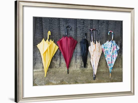 Colorful Umbrellas Leaning against a Wall-Nosnibor137-Framed Photographic Print