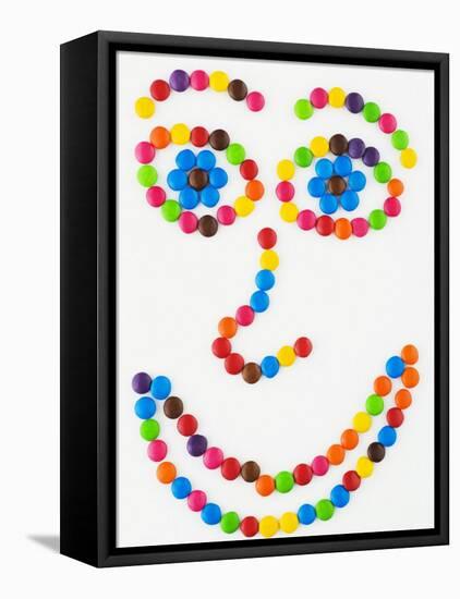 Coloured Chocolate Beans Forming a Smiling Face-Greg Elms-Framed Premier Image Canvas