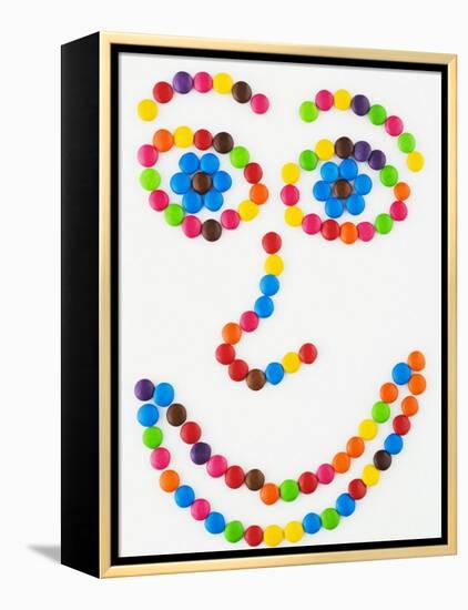 Coloured Chocolate Beans Forming a Smiling Face-Greg Elms-Framed Premier Image Canvas