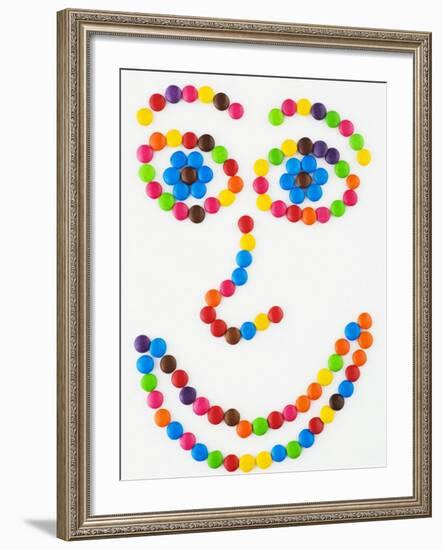 Coloured Chocolate Beans Forming a Smiling Face-Greg Elms-Framed Photographic Print