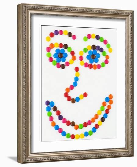 Coloured Chocolate Beans Forming a Smiling Face-Greg Elms-Framed Photographic Print