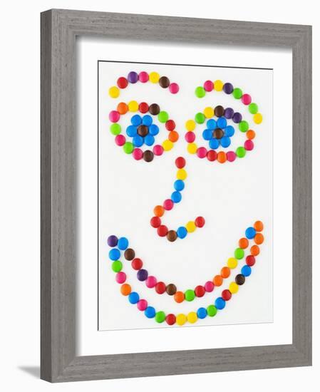 Coloured Chocolate Beans Forming a Smiling Face-Greg Elms-Framed Photographic Print