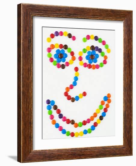 Coloured Chocolate Beans Forming a Smiling Face-Greg Elms-Framed Photographic Print