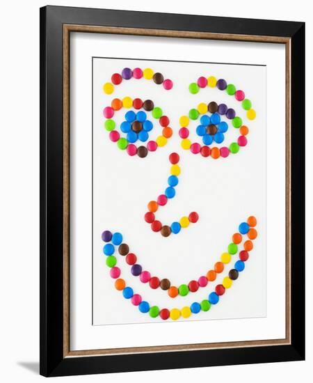 Coloured Chocolate Beans Forming a Smiling Face-Greg Elms-Framed Photographic Print