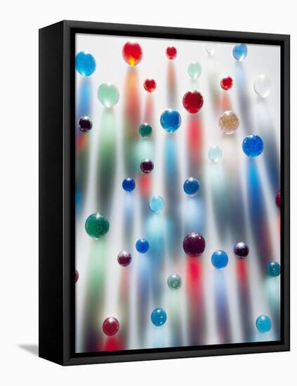 Coloured Marbles Creating Interesting Coloured Long Shadows-Frankie Angel-Framed Premier Image Canvas