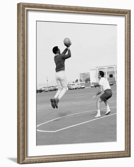 Comedian Bill Cosby Shooting Ball Against His Press Agent, Joe Sutton, During Game of Basketball-Michael Rougier-Framed Premium Photographic Print