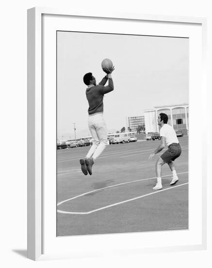 Comedian Bill Cosby Shooting Ball Against His Press Agent, Joe Sutton, During Game of Basketball-Michael Rougier-Framed Premium Photographic Print
