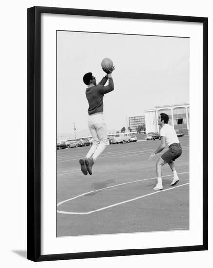 Comedian Bill Cosby Shooting Ball Against His Press Agent, Joe Sutton, During Game of Basketball-Michael Rougier-Framed Premium Photographic Print