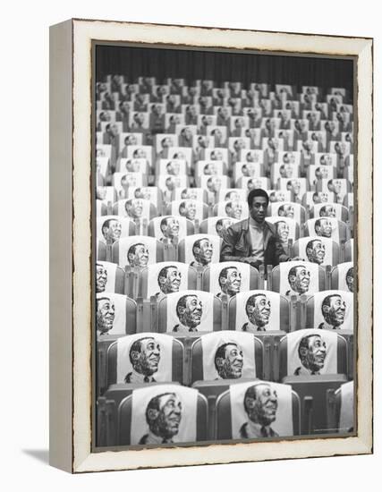 Comedian Bill Cosby Sitting in Empty Auditorium Filled with Copies of His Likeness on Each Seat-Michael Rougier-Framed Premier Image Canvas