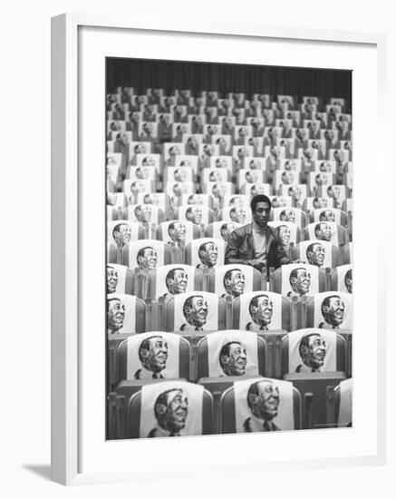 Comedian Bill Cosby Sitting in Empty Auditorium Filled with Copies of His Likeness on Each Seat-Michael Rougier-Framed Premium Photographic Print