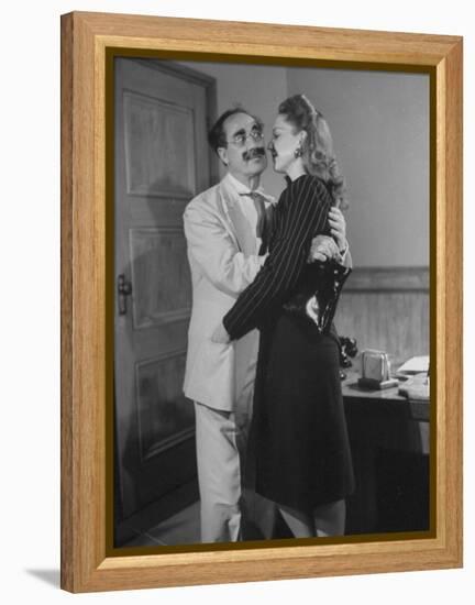 Comedian Groucho Marx Embracing a Woman-null-Framed Premier Image Canvas