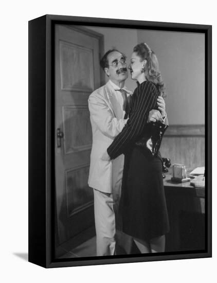 Comedian Groucho Marx Embracing a Woman-null-Framed Premier Image Canvas