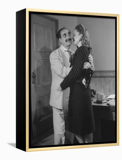 Comedian Groucho Marx Embracing a Woman-null-Framed Premier Image Canvas