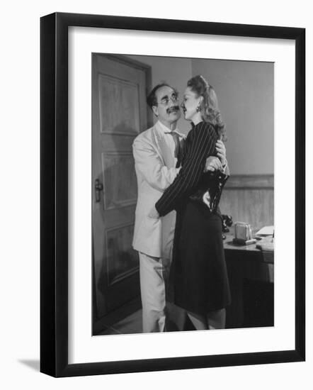 Comedian Groucho Marx Embracing a Woman-null-Framed Photographic Print