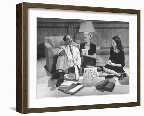 Comedian Groucho Marx Playing a Game with Two Women-null-Framed Photographic Print