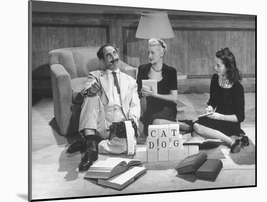 Comedian Groucho Marx Playing a Game with Two Women-null-Mounted Photographic Print