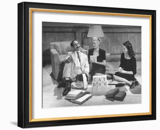 Comedian Groucho Marx Playing a Game with Two Women-null-Framed Photographic Print