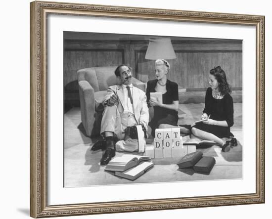 Comedian Groucho Marx Playing a Game with Two Women-null-Framed Photographic Print