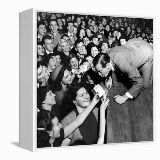 Comedian Milton Berle Trying to Kiss Fans Who Are Asking for Autographs-George Silk-Framed Premier Image Canvas