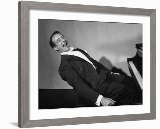 Comedian Pianist Victor Borge, in White Tie and Tails, Sitting at Piano and Making Funny Faces-Peter Stackpole-Framed Premium Photographic Print