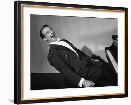 Comedian Pianist Victor Borge, in White Tie and Tails, Sitting at Piano and Making Funny Faces-Peter Stackpole-Framed Premium Photographic Print