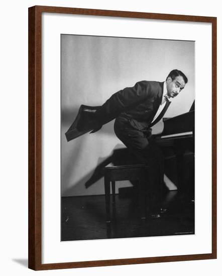 Comedian Pianist Victor Borge, in White Tie and Tails, Standing at Piano and Making Funny Faces-Peter Stackpole-Framed Premium Photographic Print