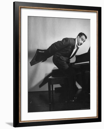 Comedian Pianist Victor Borge, in White Tie and Tails, Standing at Piano and Making Funny Faces-Peter Stackpole-Framed Premium Photographic Print